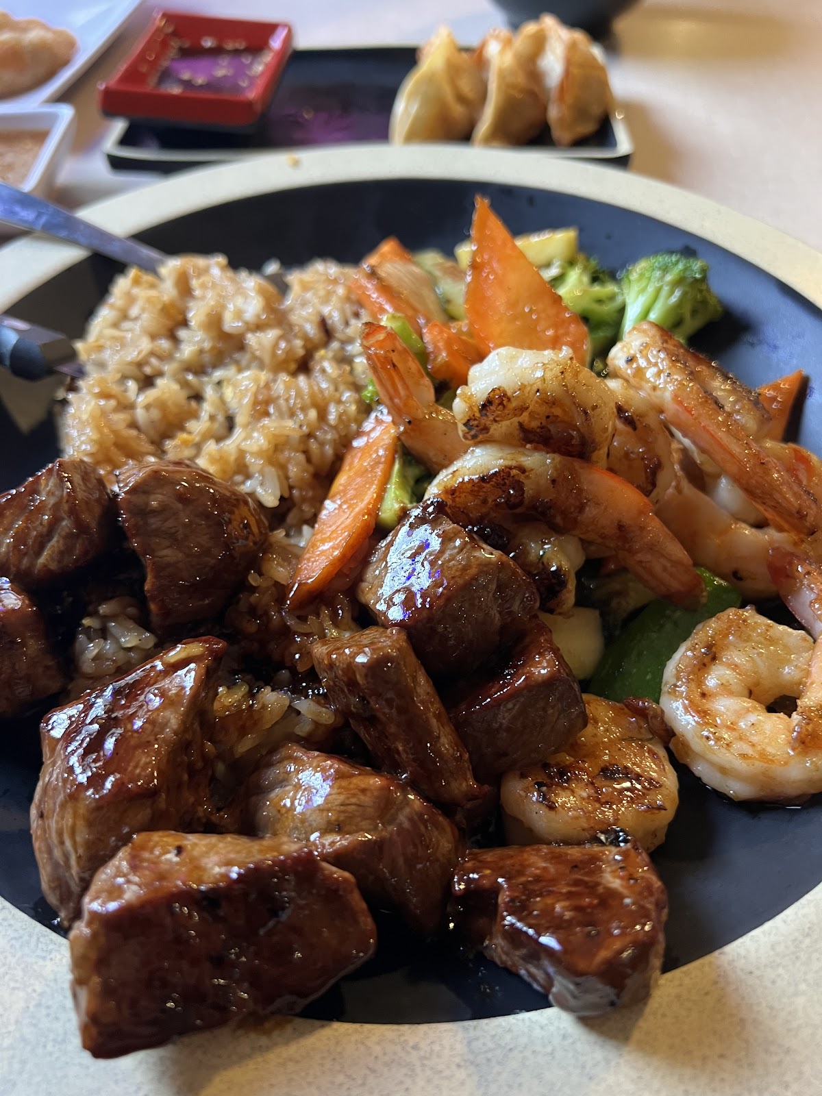 Steak and shrimp hibachi with grilled vegetables and fried rice