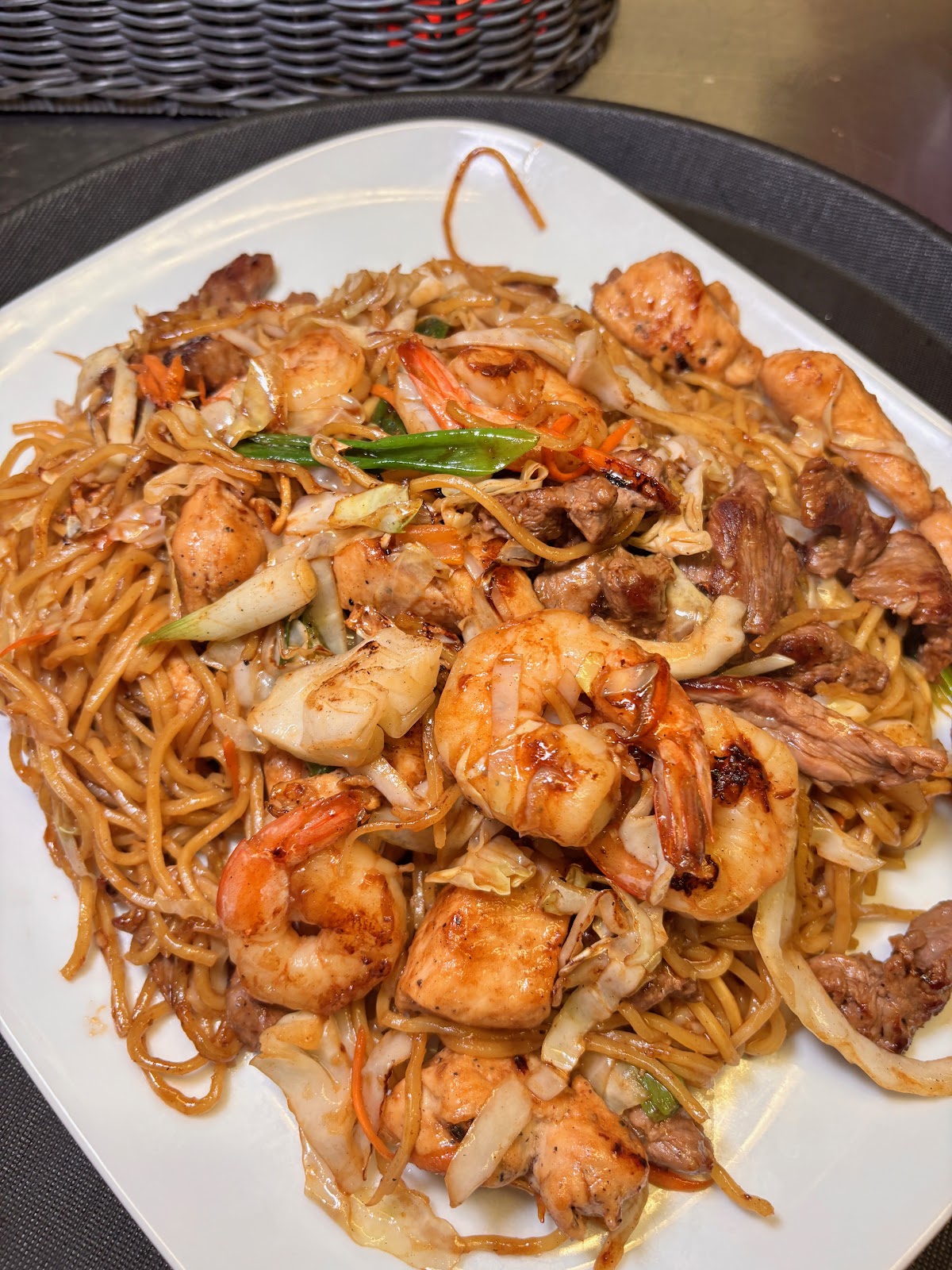 Yakisoba noodles stir-fried with shrimp, chicken, and steak