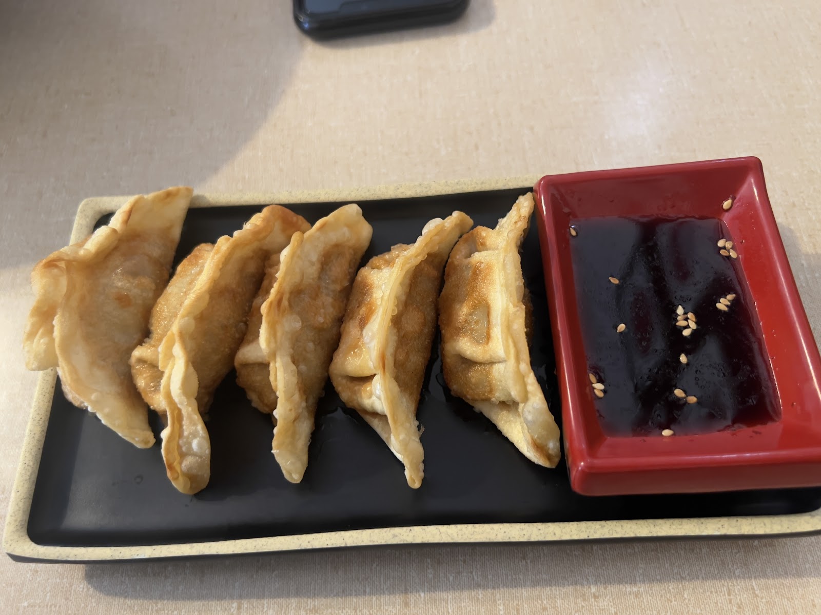 Pan-fried gyoza dumplings with dipping sauce